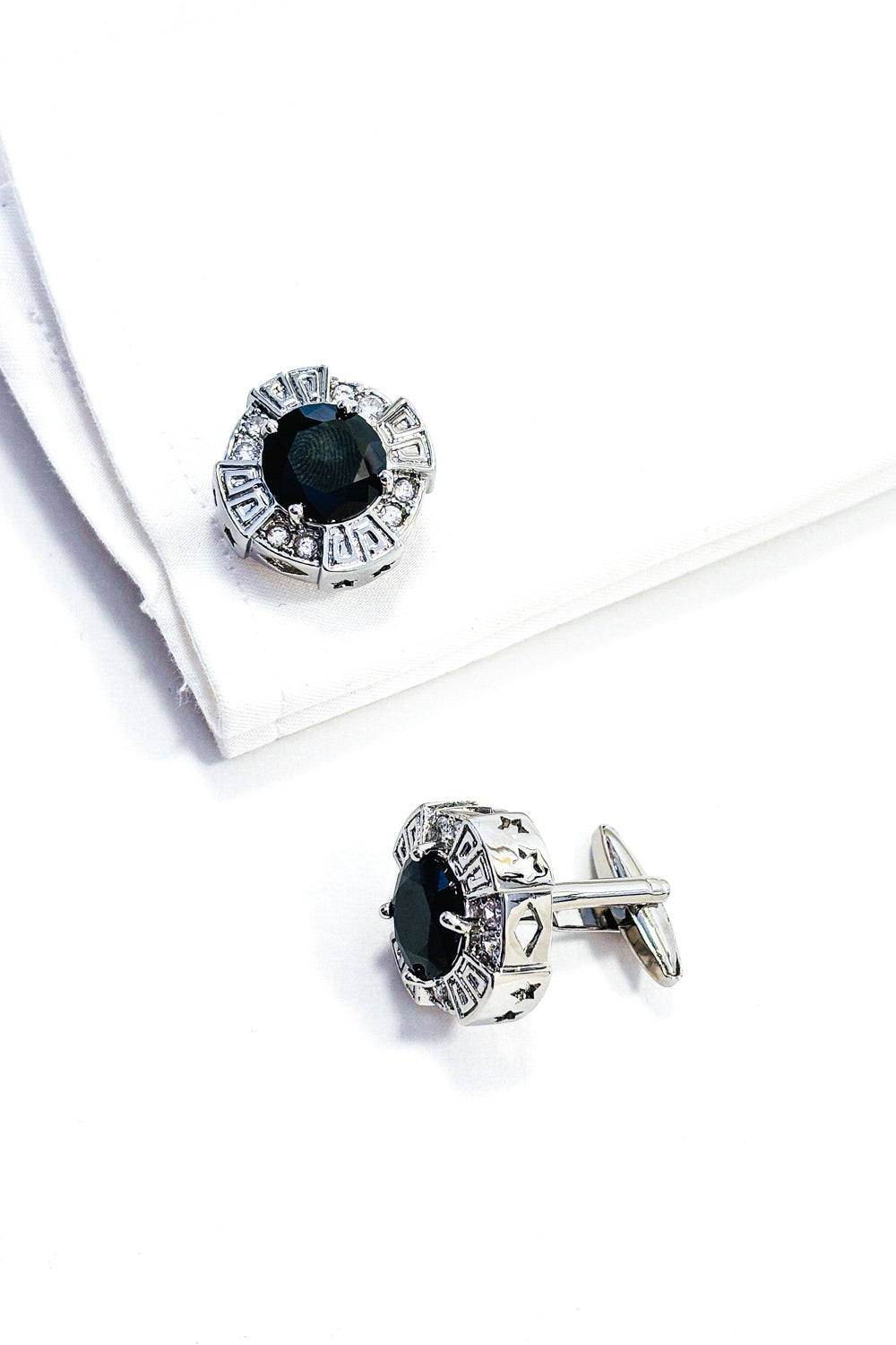 Silver round black crystal cufflinks.
