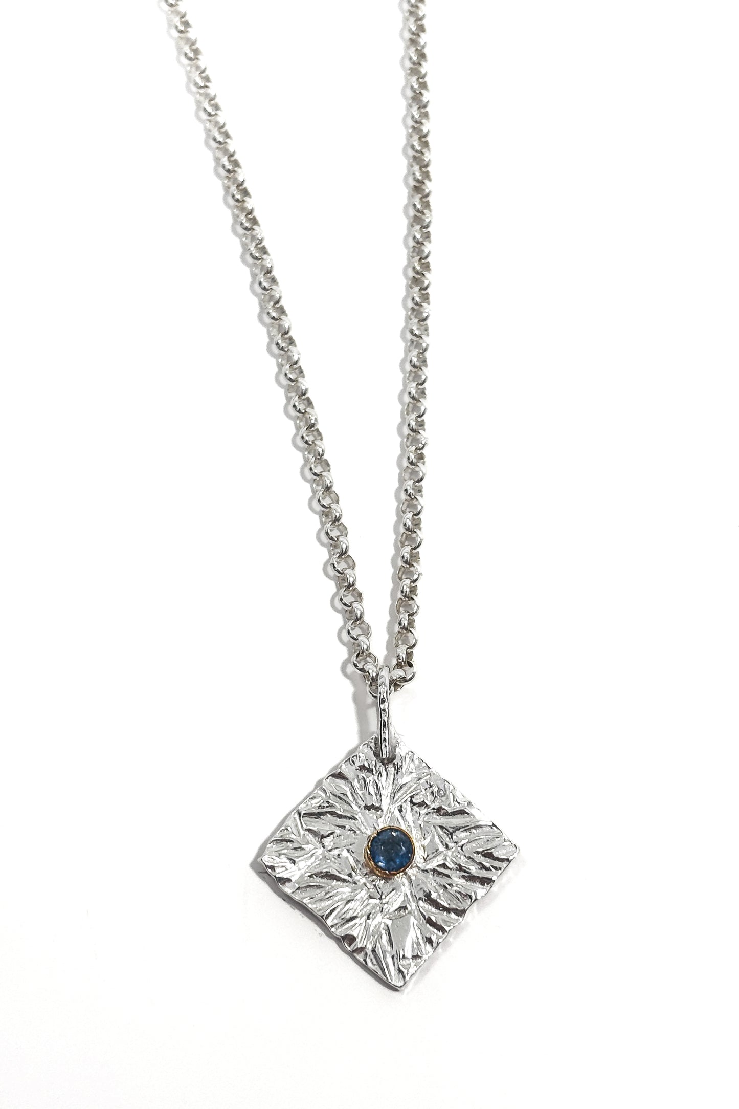 Sapphire bezel set 925 silver pendant.
