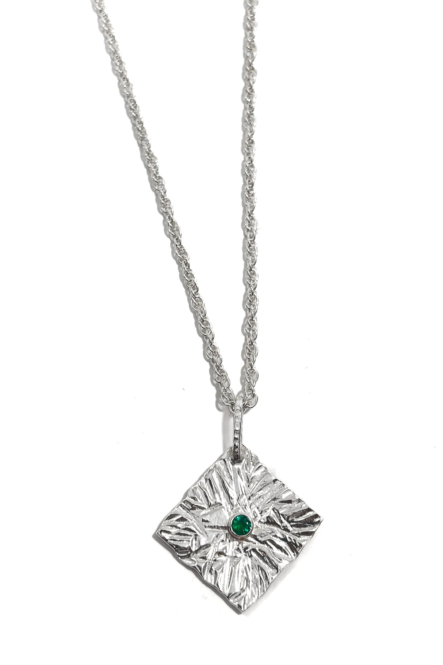 Emerald bezel set 925 silver pendant.
