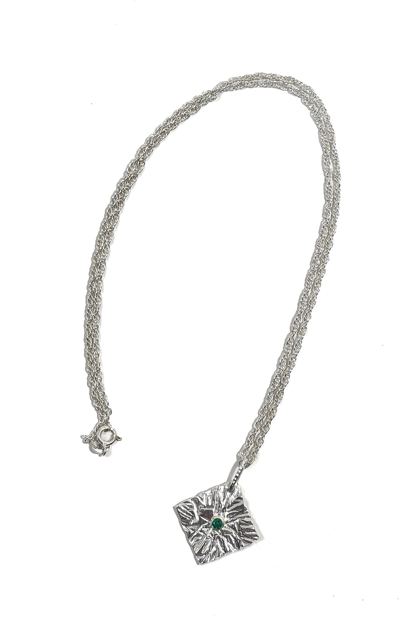 Emerald bezel set 925 silver pendant.