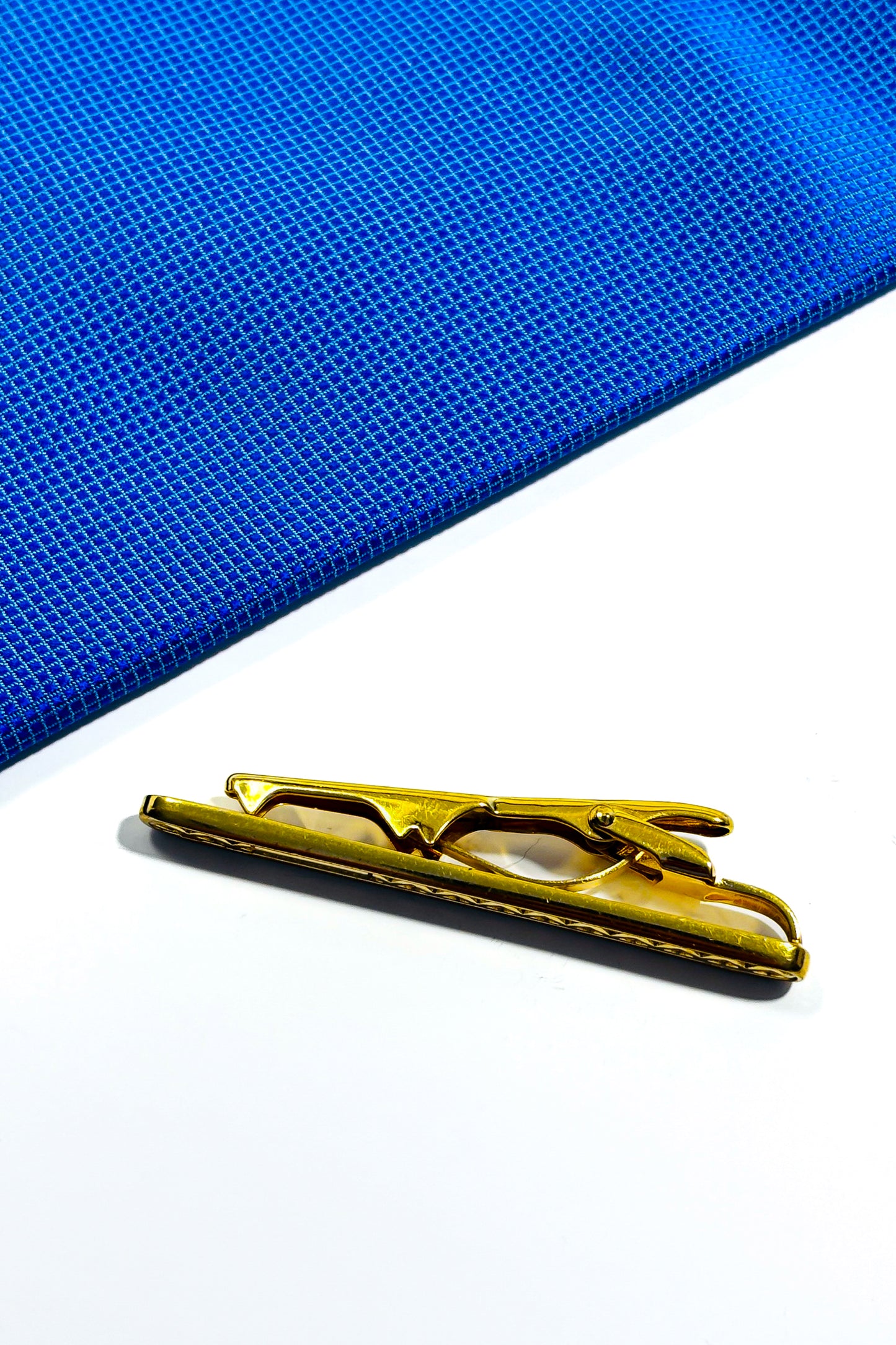 Gold plated Burberry tie clip.