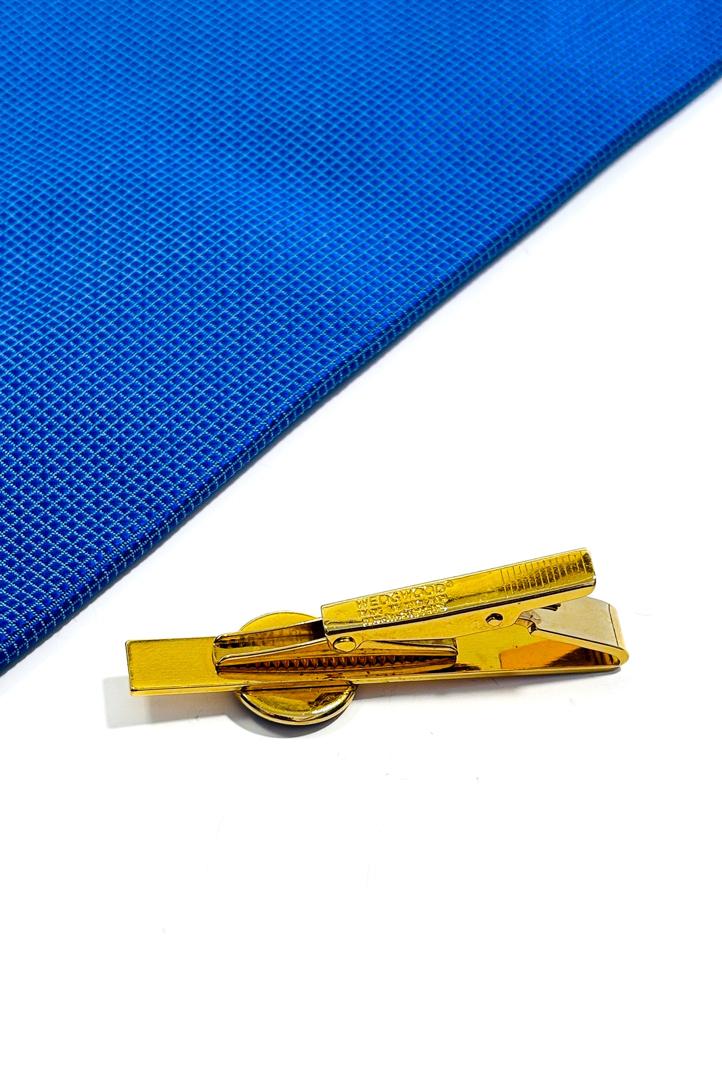 Gold plated wedgwood tie clip.