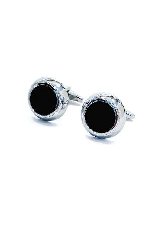 Silver cufflinks with black centres.