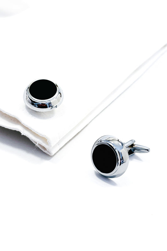 Silver cufflinks with black centres.