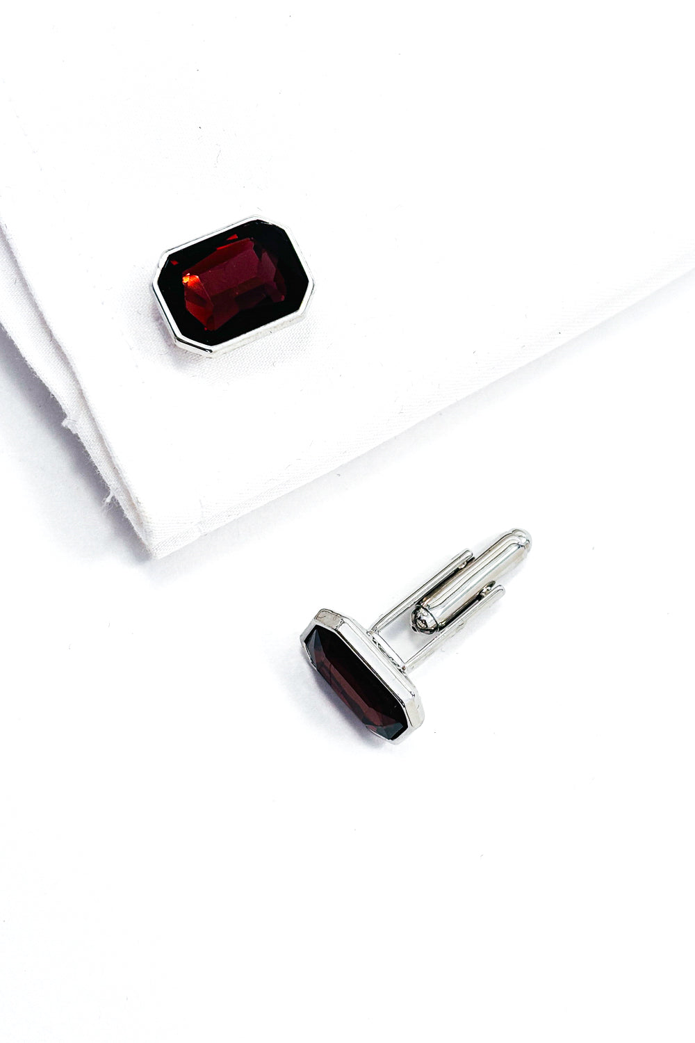 Garnet red emerald cut silver cufflinks.