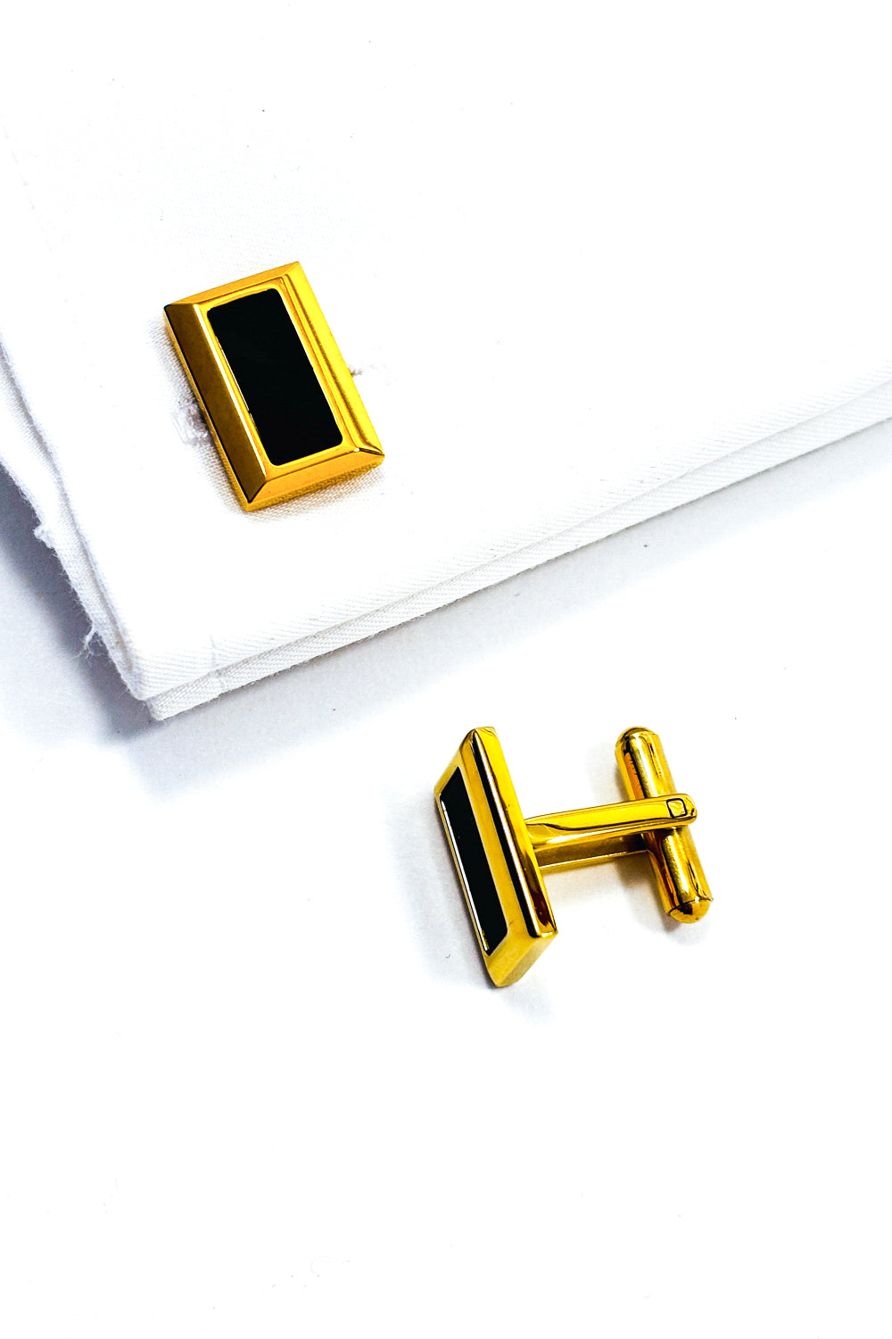 Gold rectangle black centre cufflinks.