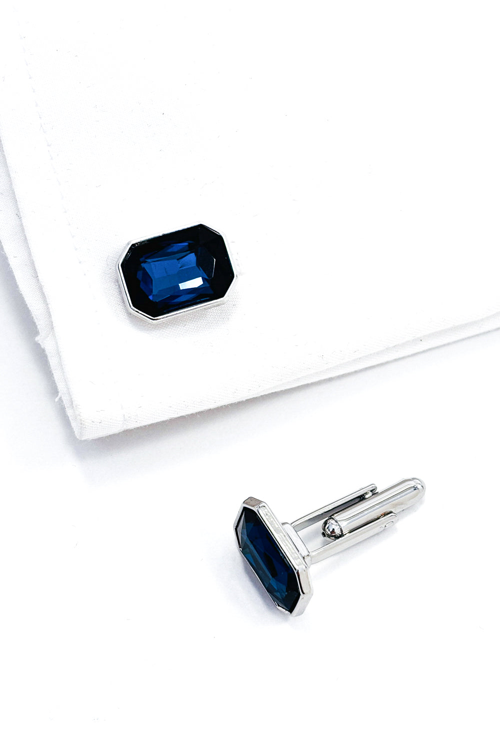 Ceylon blue emerald cut silver cufflinks.