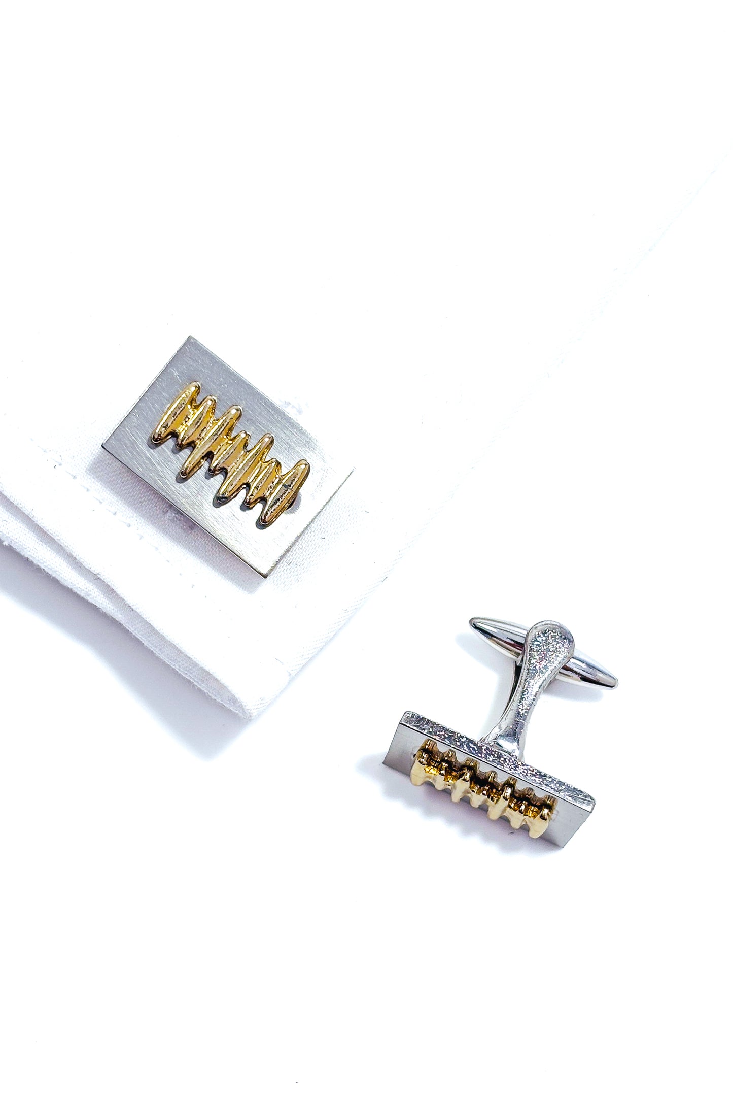 Stainless steel gold plated bar design cufflinks.