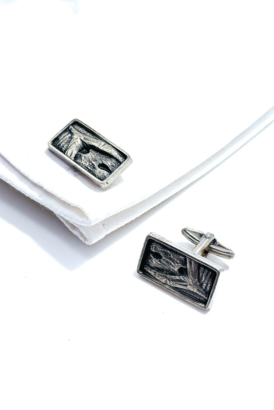 Stainless steel abstract whale tail design cufflinks.