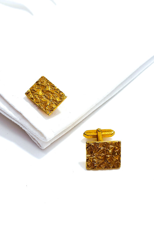 Stainless steel gold plated textured design cufflinks.