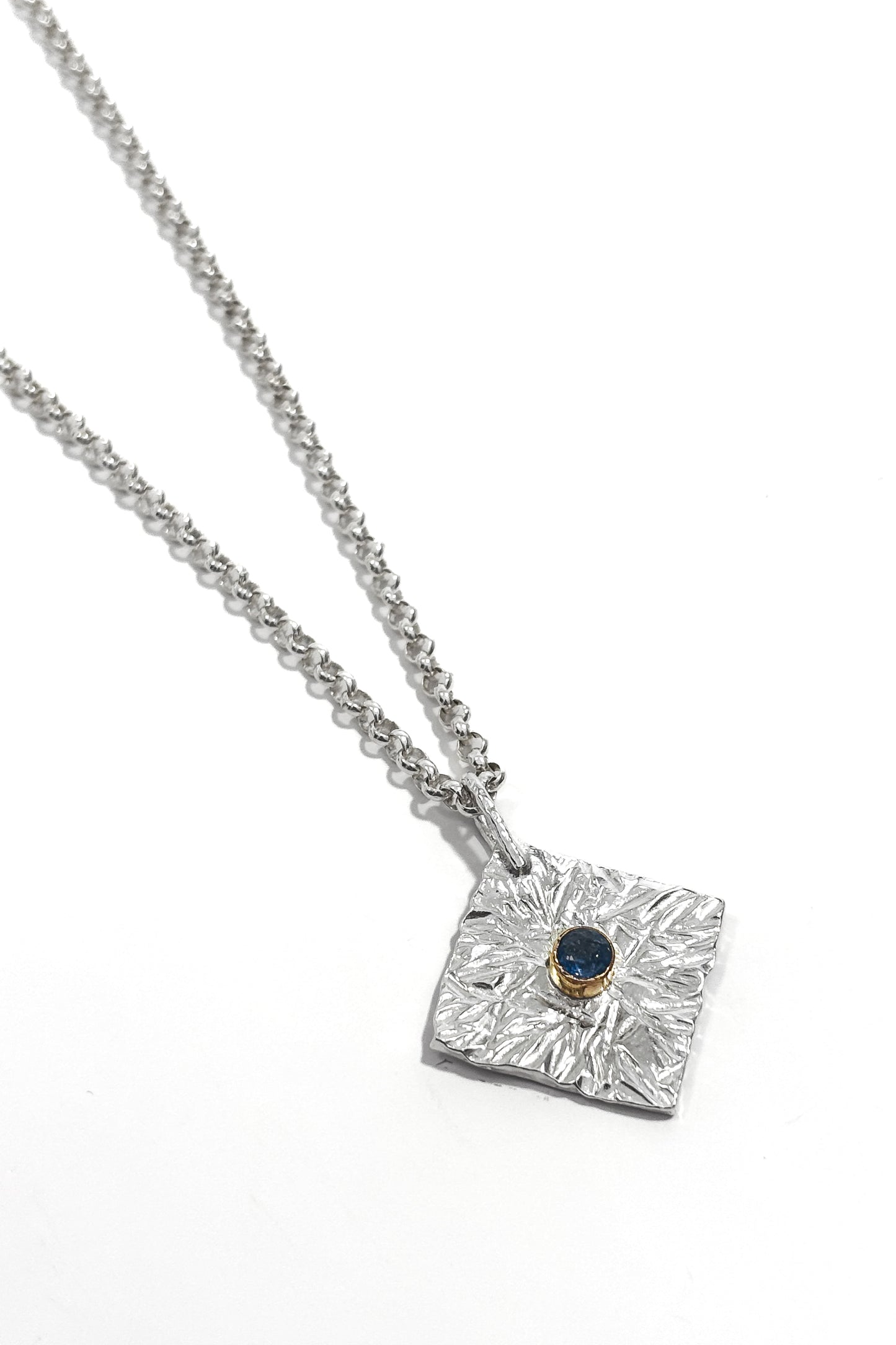 Sapphire bezel set 925 silver pendant.
