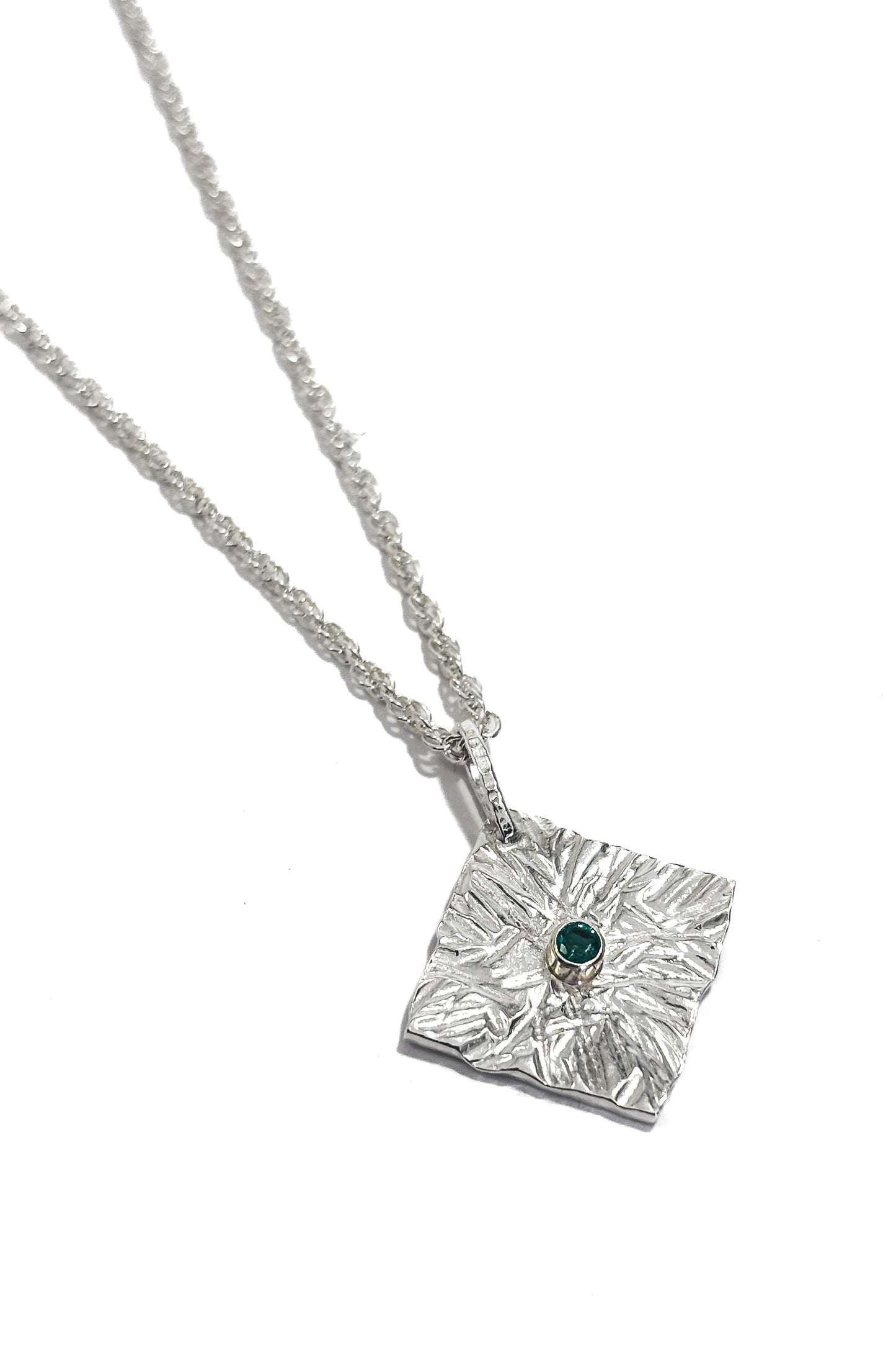 Emerald bezel set 925 silver pendant.