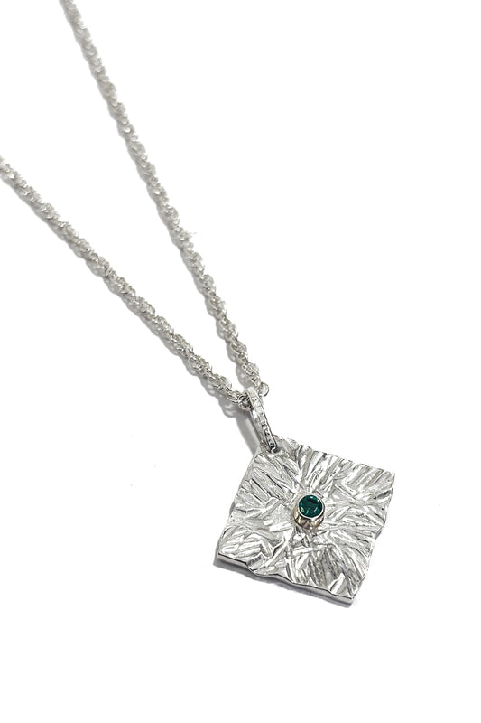 Emerald bezel set 925 silver pendant.