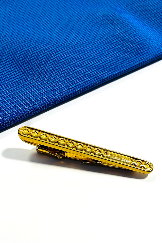 Gold plated Burberry tie clip.